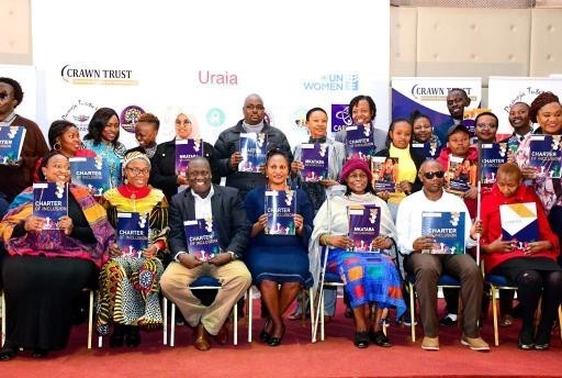 Officials of CRAWN Trust together with Registrar of Political Parties (Centre) in a group photo at Desmond Tutu conference centre on 2nd August, 2022